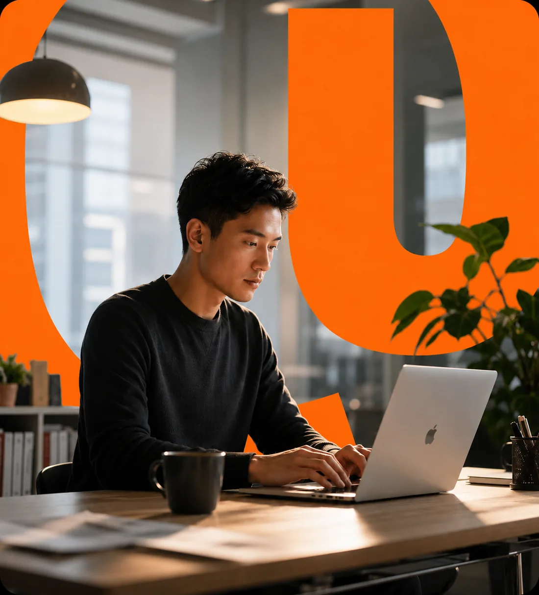 Citizen developer building a low-code Power Apps canvas application on a laptop in a modern office